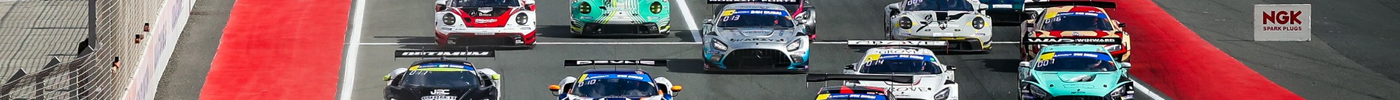 GT3 race cars on the start grid at Dubai Autodrome