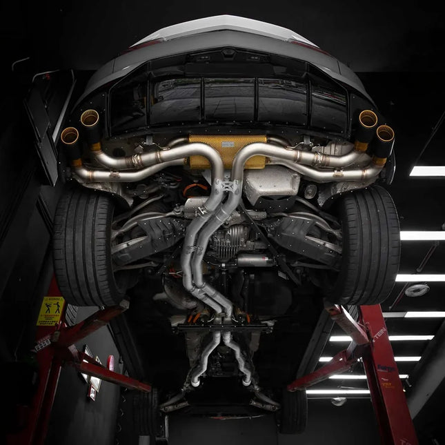 Lamborghini Urus SE with an installed iPE Valvetronic exhaust and black exhaust tips with gold accents